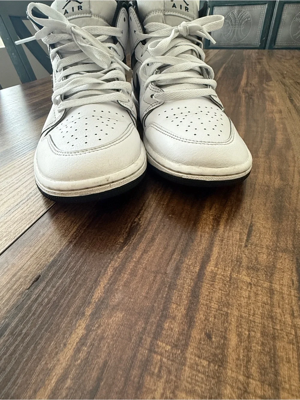Nike Air Jordan 1 White and Black Mid-Top Sneakers